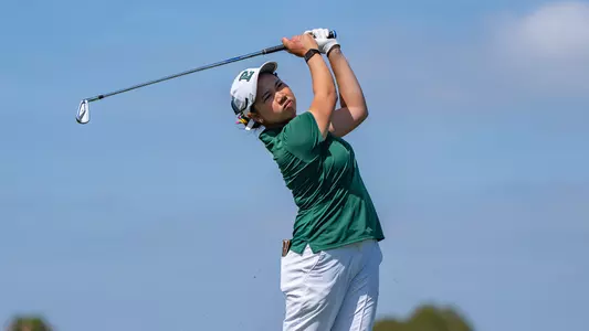 Baiyok Sutkerm finishes her swing and stares down the ball on her approach into the green at the GameAbove Golf Invitational