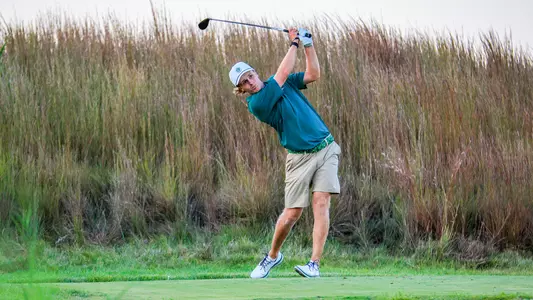 Joshua Hess watches the track of his tee shot at the Highlands Invitational