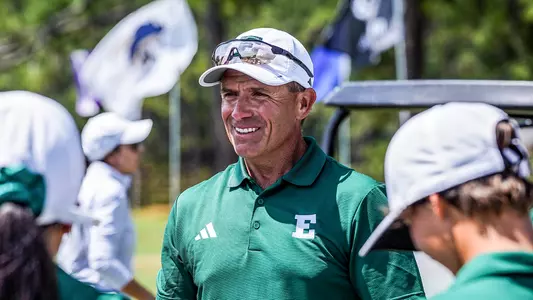 Josh Brewer smiles while talking to the team after their victory at the season-opening The Southern