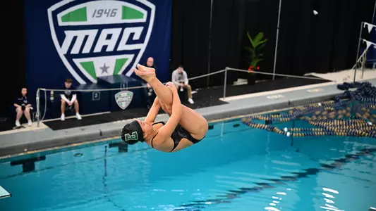 Cate Migliori diving at the 2026 MAC Championships