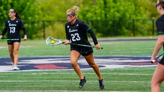 Mackenzie Blackwell carries the ball into the offensive zone in the 2026 MAC Championships semifinal game against Akron