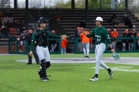 Nick Weaver (left) acknowledges Tommy Rose's (right) solid inning with a dap as they head to the dugout against Bowling Green at Oestrike Stadium, May 2, 2026