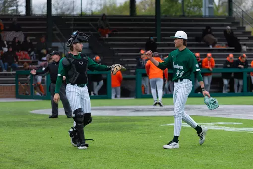 Nick Weaver (left) acknowledges Tommy Rose's (right) solid inning with a dap as they head to the dugout against Bowling Green at Oestrike Stadium, May 2, 2026