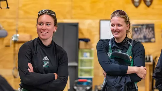 Eastern Michigan Rowing student-athletes Natalie Prairie (left) and Gabby Charvat (right) smile at the EMU Rowing Course at Ford Lake on a sunny day to celebrate Senior Day against the University of Dayton Flyers, May 3, 2026