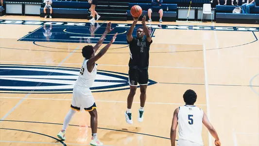 Emanuel Richards with a basketball in his right hand and feet off the ground shortly after jumping at University of Windsor, Aug. 15, 2026