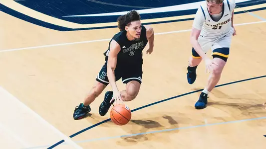 Jabri Fitzpatrick dribbling a basketball with his right hand with his right foot planted at University of Windsor, Aug. 15, 2026