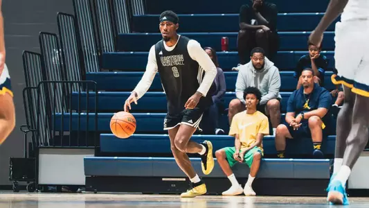 Sencire Harris releasing a basketball from his right hand while wearing a headband at University of Windsor, Aug. 15, 2026