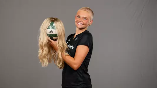 Taeley Mahler media day photo with her wig on a volleyball