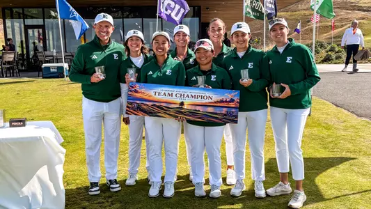 The EMU Women's Golf Team poses with their trophies and placard after winning the 2026 Leadership & Golf Invitational at Chambers Bay in University Park, Wash.