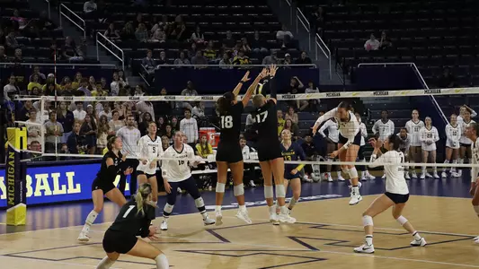 Azra Eriç and Taeley Mahler block against Michigan Sept. 17, 2026