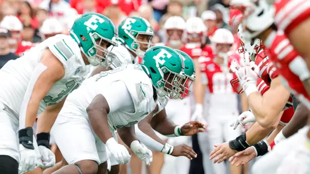 The Eastern Michigan defensive line jumps into action on the snap at Wisconsin