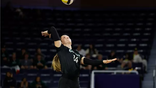 Julia Johnson focuses on a serve a Michigan, Sept. 17, 2026