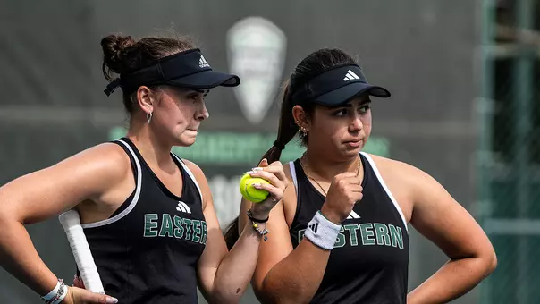 Sabrina Tolstova (L) and Valentina Salek meet during a doubles match against Ferris State, Sept. 25, at the EMU Hidden Duals