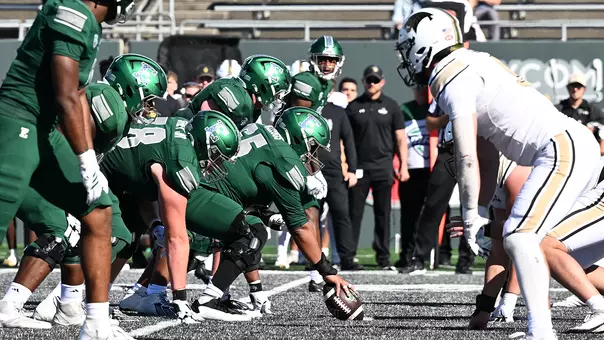 Nick Gallegos (center) prepares to snap the ball on offense against Lindenwood