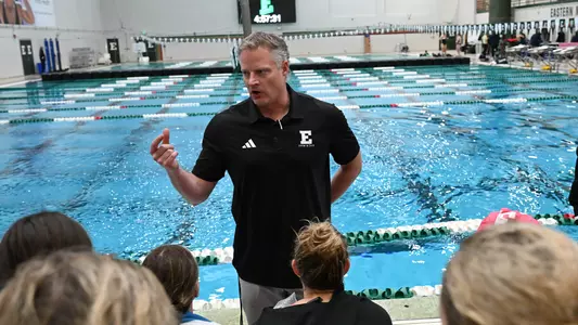 Head Swim Coach Derek Perkins talk to team at home meet against Akron, Oct. 31, 2025