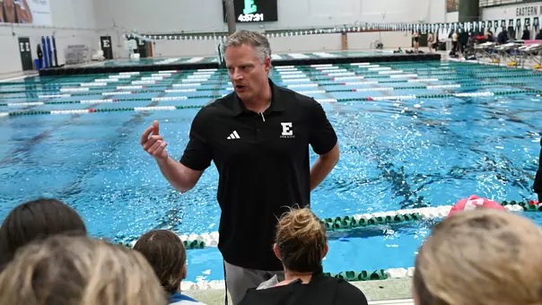 Head Swim Coach Derek Perkins talk to team at home meet against Akron, Oct. 31, 2025