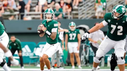 Noah Kim drops back to pass against San Jose State with Cole Dellinger providing protection