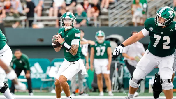 Noah Kim drops back to pass against San Jose State with Cole Dellinger providing protection