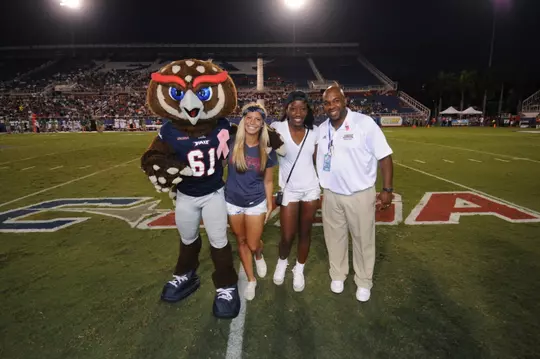 2013 FAU Football vs Marshall: Owlsley, Amanda Odato, SAAC President, Danielle Aromashadu, SAAC Secretary and Marlon Dechausay, Associate AD-Director SACA