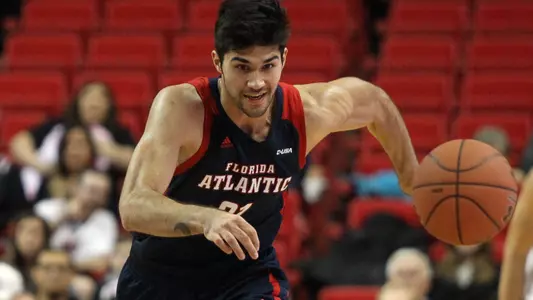 Dec 19, 2017; Lubbock, TX, USA; Florida Atlantic Owls forward Simeon Lepichev (21) and Texas Tech Red Raiders guard Justin Gray (5) play for the ball in the first half at United Supermarkets Arena. Mandatory Credit: Michael C. Johnson-USA TODAY Sport