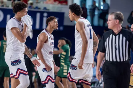 Kanaan Carlyle and Devin Williams celebrating during a media timeout