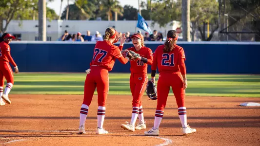 Cameryn Orland, and Jaden Martinez celebrating after a strikeout