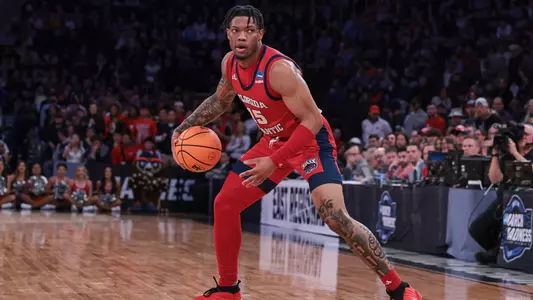 Alijah Martin dribbling at the Elite Eight against Kansas State at Madison Square Garden