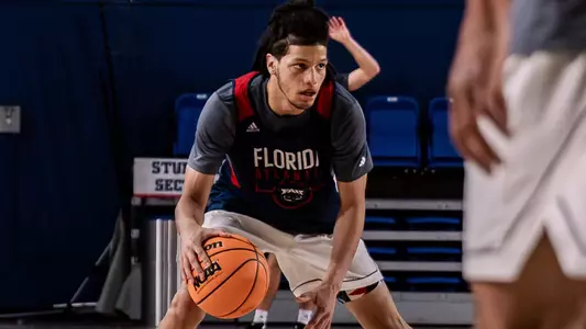 Felipe Quinones dribbling during practice