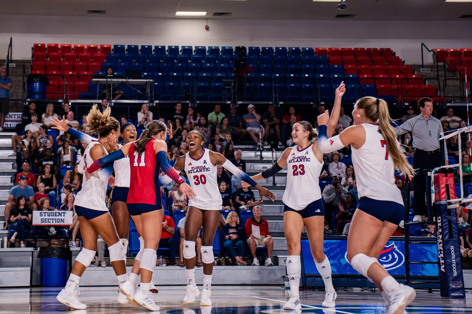 Volleyball celebrating a win after their match against Stetson.