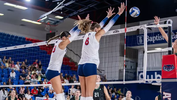 Anna Hartman and Libby Ashline blocking against FIU