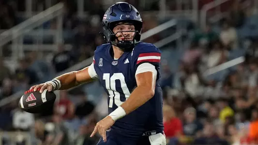 Caden Veltkamp throwing the ball in the 38-30 win against Navy