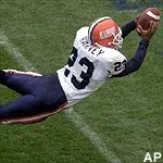 Halfback Rockey Harvey<br>dives into the<br>endzone on a 59-<br>yard touchdown play<br>in the fourth quarter<br>against Michigan Saturday.
