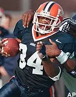 Illinois fullback Jameel Cook tries to break free from a Northwestern defender in the first half Saturday.