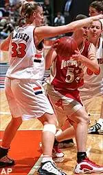 Illinois' Susan Blauser and Kylie Martin surround Boston College's Kim Mackie under the basket during their Women's Preseason NIT consolation game on Monday.