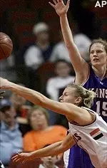 Illinois forward Susan Blauser tries to recover the ball as Kansas guard JenniferJackson blocks during first half action Saturday.