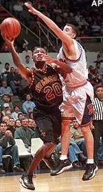 Bethune-Cookman's Tyris Livas shoots while being guarded by Illinois' Nate Mast during the first half at the Assembly Hall in Champaign, Ill. Tuesday.