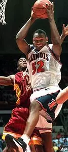 Illinois' Marcus Griffin (52) brings down a rebound in front of Loyola's Daniel McSwine during the first half of Thursday's game.