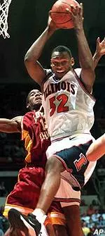 Illinois' Marcus Griffin (52) brings down a rebound in front of Loyola's Daniel McSwine during the first half of Thursday's game.