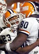 Illinois halfback Rocky Harvey is congratulated by tight end Brian Hodges after Harvey scored a touchdown in the third quarter against Virginia in the Micronpc.com Bowl in Miami, Thursday, Dec. 30. Illinois beat Virginia 63-21.