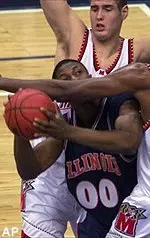 Illinois forward Victor Chukwudebe gets caught up with Maryland forward Terence Morris and center Mike Mardesich during the first half of their game in the BB&T Classic at the MCI Center in Washington.