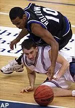 Illinois guard Nate Mast and Seton Hall guard Shaheen Holloway battle for a loose ball during the first half in the BB&T Classic game at the MCI Center in Washington.