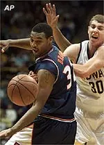 Illinois' Cleotis Brown looks to grab the ball after knocking it away from Iowa's Kyle Galloway in the first half of Wednesday's game.