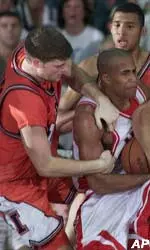 Illinois' Robert Archibald wrestles the ball away from Arizona.