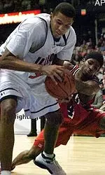 Illinois' Brian Cook, left, and Illinois-Chicago's Jon-Pierre Mitchom battle for the ball in the second half at the Allstate Arena in Rosemont, Ill., Friday.