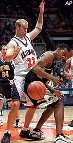 Lucas Johnson guards Iowa's Duez Henderson as the ball gets loose in the first half Saturday.