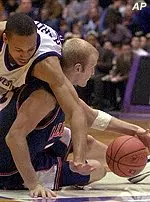 Lucas Johnson battles for the ball with Northwestern's Tavaras Hardy.