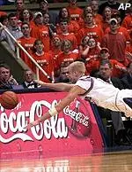 Illinois' Lucas Johnson dives for a loose ball against Northwestern.