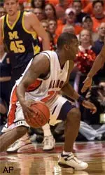 Jerrance Howard looks for an opening during the first half of the Illini's 80-51 victory over Michigan Saturday night.