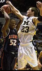 Illinois' Marcus Griffin battles with Michigan's Gavin Groninger for a rebound during the first half at Crisler Arena in Ann Arbor, Mich., Thursday.