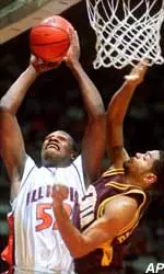 Illinois' Marcus Griffin (52) goes up for a basket as Minnesota's John-Blair Bickerstaff (1) during the first half at Assembly Hall in Champaign, Ill., on Wednesday.
